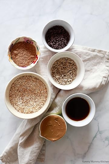 Ingredients for no-bake energy balls include oats, flax meal, sunflower seed butter, and maple syrup.