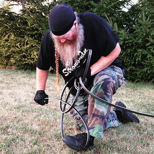 Strongman Chris Rider scroll work