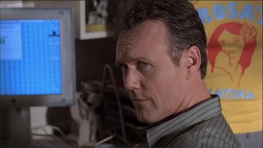Giles is looking at Buffy with an expression that says plainly 