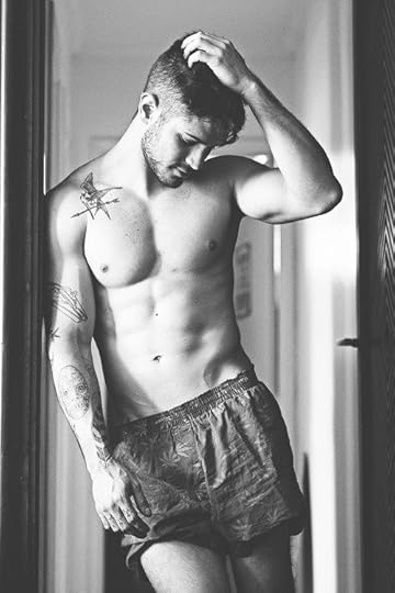 image of shirtless man with tattoos in marijuana boxer shorts