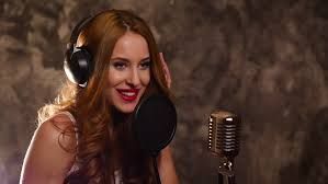 singing in recording studio