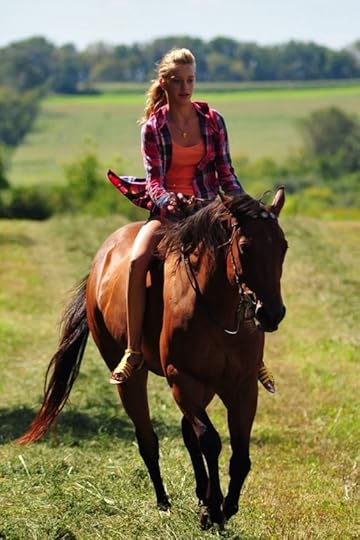 redhead woman riding horse bareback