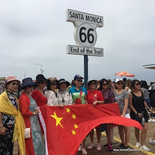 tour group from Wenzhou, China at the Route 66 sign on the Santa Monica Pier in Santa Monica, California