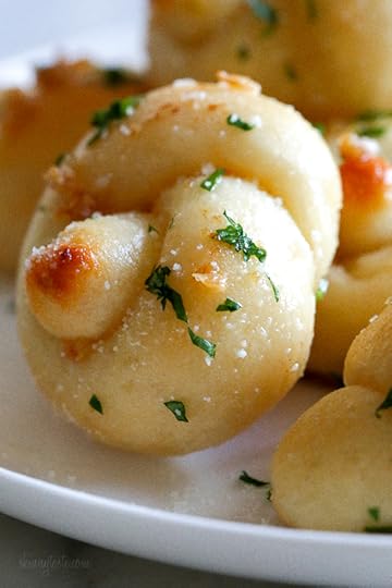 These soft, garlicky knots taste just like your favorite pizzeria’s garlic knots, but made from scratch using my easy yeast-free bagel dough recipe (just flour, Greek yogurt, baking powder and salt).