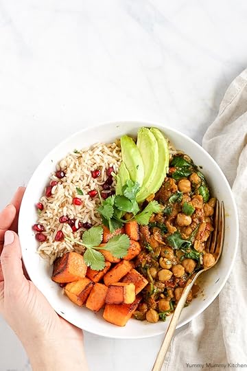 Chana masala, Indian chickpea curry, bowl with rice, avocado, and butternut squash.