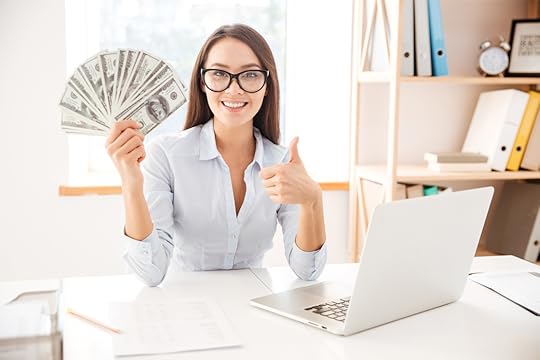 girl holding money and giving thumbs up