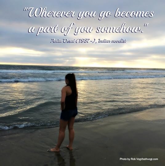 girl standing on a beach at sunset