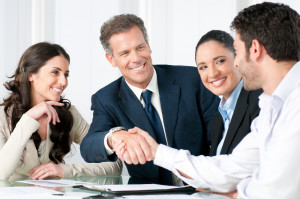 bigstock-Mature-businessman-shaking-han-14508995