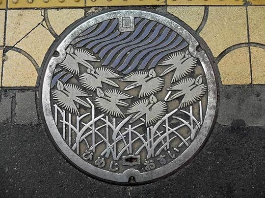 sewer drain manhole cover Japan Kobe Himeji by Jennifer Hallock author of Sugar Sun steamy historical romance series. Serious history. Serious sex. Happily ever after.