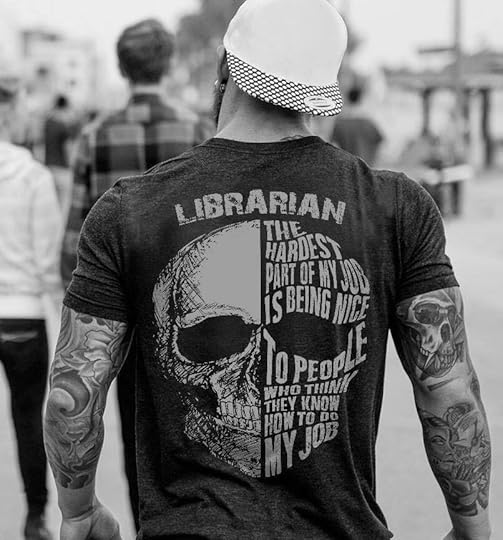 image of a muscular man in a t-shirt that says 