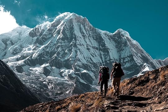 Two people mountain climbing