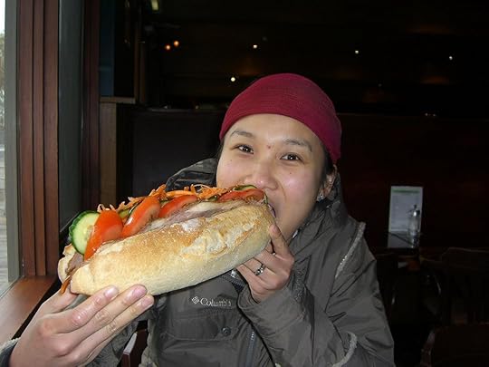 Woman eating sandwich
