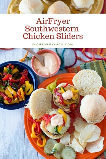 Game Day food on the table with Southwestern Chicken Sliders, airfryer bell peppers, Sriracha mayonnaise on a orange Fiesta-ware plate.