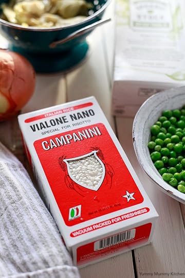 The ingredients for this easy homemade pea risotto includes onion, rice, and broth.