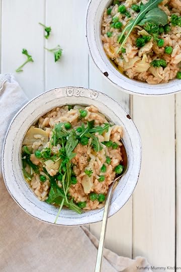 These two lovely bowls of creamy risotto with peas and artichokes were made in the instant pot pressure cooker. They are topped with arugula and herbs. This easy risotto is vegan and gluten free.