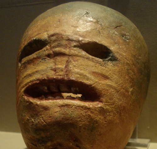A carved rutabaga emoting what it feels like to be a rutabaga or to think about the existence of rutabagas i.e. abject horror
