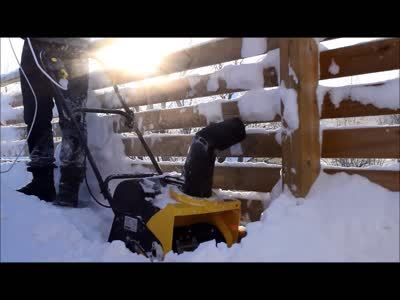 Shovelling snow from the balcony