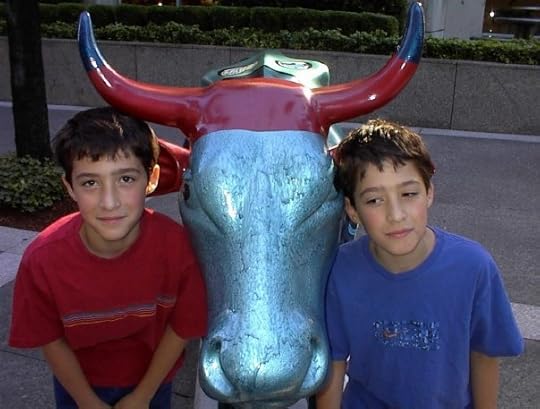 twins with cow statue