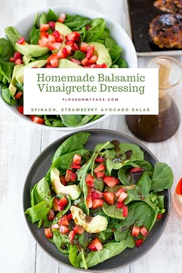 Homemade Balsamic Vinaigrette Dressing in a bottle next to a serving bowl recipe served on a Spinach, Strawberry and Avocado Salad