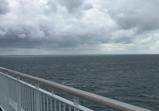 The shores of Normandy appearing, from ferry Mont St. Michel, September 2017
