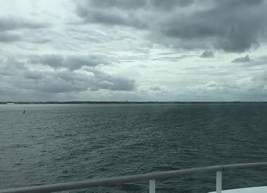 The shores of Normandy appearing, from ferry Mont St. Michel, September 2017