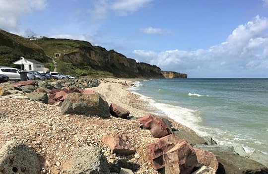 Looking west from the Vierville draw toward Charlie Beach. Note the German gun position in the cliff, Vierville-sur-Mer, France, September 2017 (Photo: Sarah Sundin)