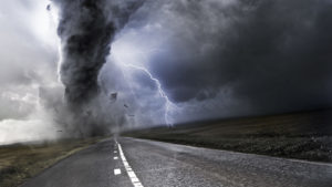 Powerful Tornado - destroying property with lightning in the background