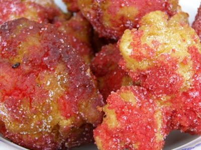 castagnole - Italian fritters drizzled in honey or rolled in sugar with the ruby colored alkermes liquor atop, for Fat Tuesday