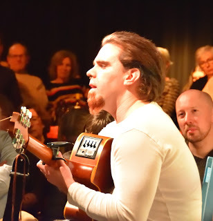 Thomas Healy played the harp, recieted poetry and played guitar and sang.