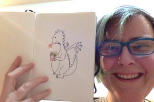Dragon holding Shadow Girl book