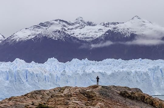 Man in front of glacier