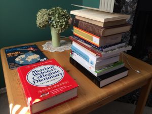 The stack of books Paul is reading