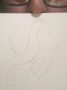 Dragon sketch with my nose and glasses peeking over the top