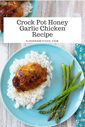 Easy Crock Pot Honey Garlic Chicken Thigh recipe served on white rice.