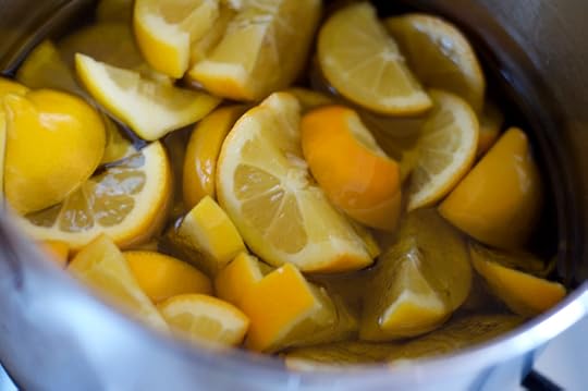 Sliced lemons in a pot for lemon confit