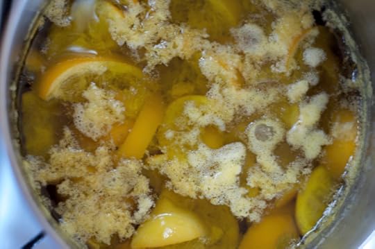 Lemon confit cooking at a bare simmer