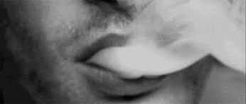 smoke coming out of man's mouth