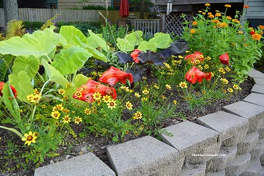 Fish in the garden sculptures and Flowers