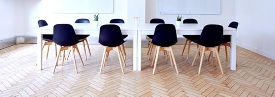 A conference room with several identical chairs