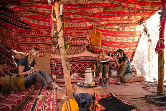 Photographer and women in tent