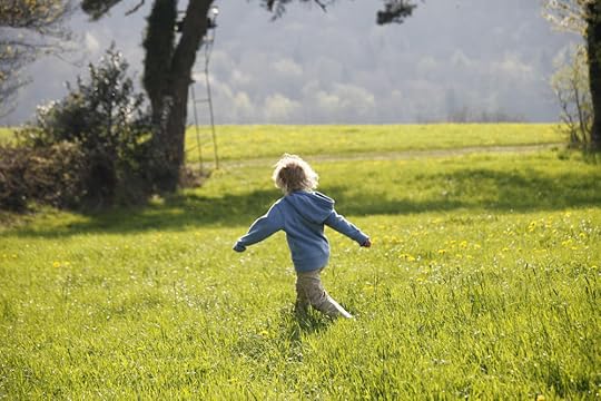 Child running in the fields