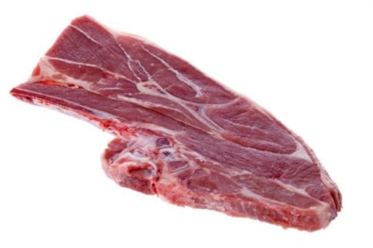 Isolated image of raw lamb shoulder.