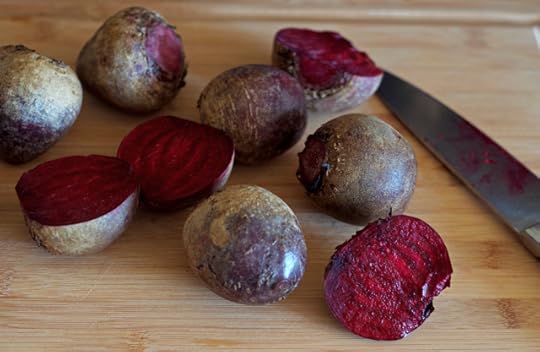 Cut beets on a cutting board for beet raisins. 