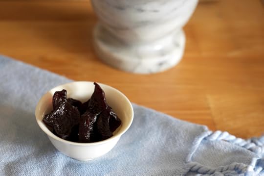 Finished beet raisins in a small bowl. 