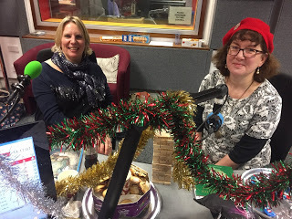 photo of Debbie and Caroline in tinsel-decked recording studio