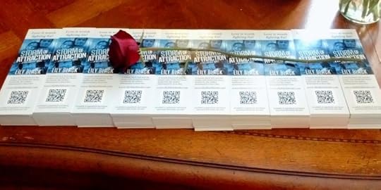 One thousand bookmarks of Storm of Attraction, plus a rose.