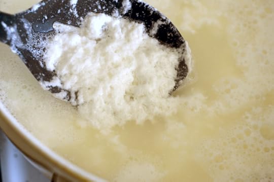 Milk separating into curds for homemade paneer cheese. 
