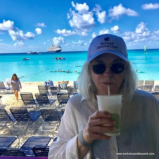 Carole Terwilliger Meyers sips a pina colada on Half Moon Cay, Bahamas