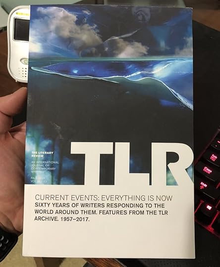 Here I am holding one of my contributor's copies. You can see my daughter's monitor in the background because it is basically always with me unless she is awake, and then she is with me. That is how I roll.