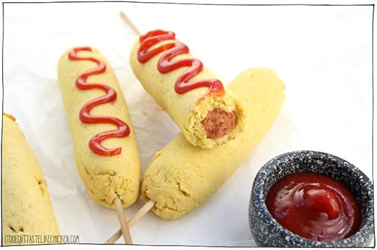 Baked Vegan Corn Dogs! A healthier version of this awesome fair food made at home. Crispy, flaky, lightly sweet, seasoned cornmeal crust is so tasty, it tastes like the best cornbread ever is wrapped around your veggie dog. Serve hot out of the oven with ketchup or mustard and oooeee are you in for a treat! #itdoesnttastelikechicken #veganrecipes #bakednotfried #snack